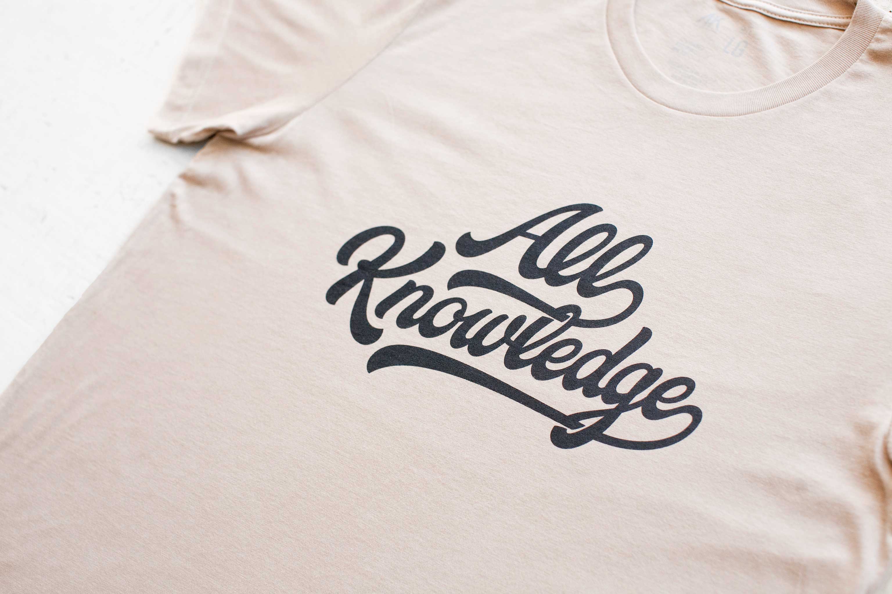 All Knowledge Script T-Shirt – Sand