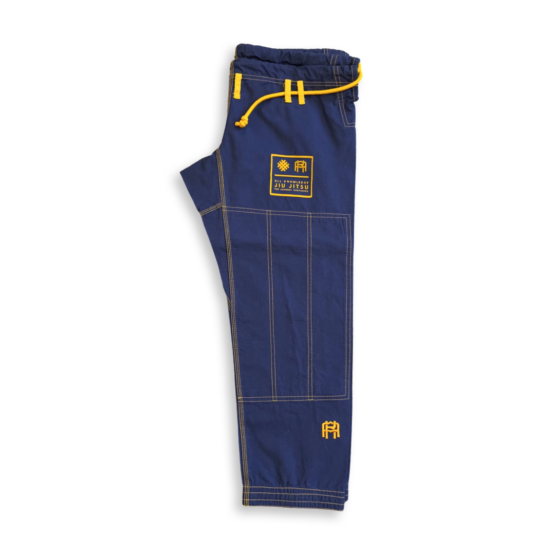 Blue jiu-jitsu pants with yellow accents on a white background